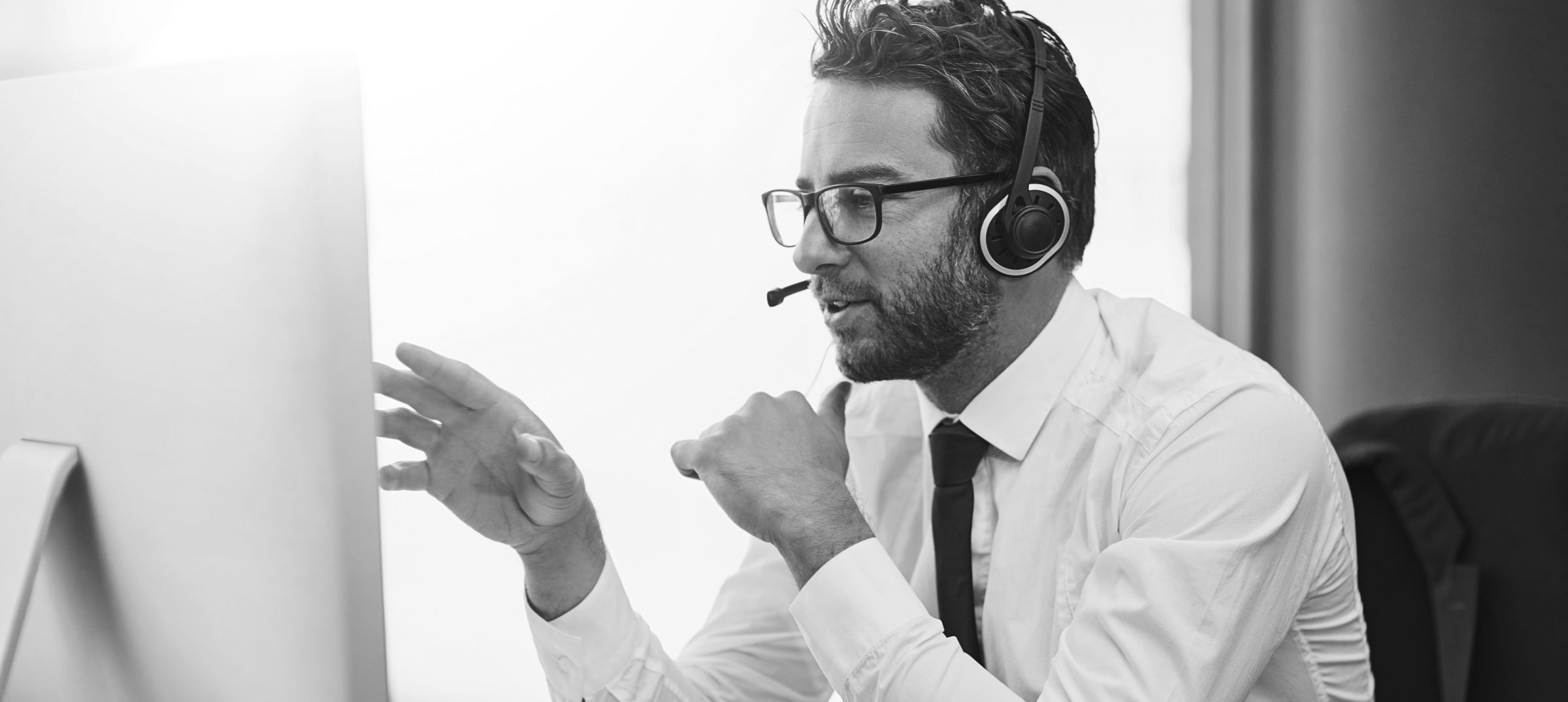 Man with headset helping a customer