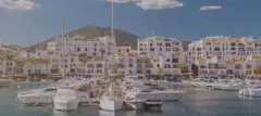 Marbella harbor with boats in the front of the houses