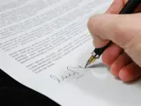 Person signing a contract