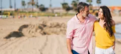 Couple walking on a sandy beach